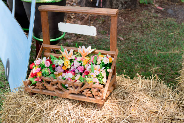istock Basket of flowers placed on straw. 964758978
