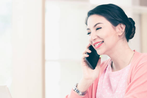istock attractive businesswoman sitting working 964759606