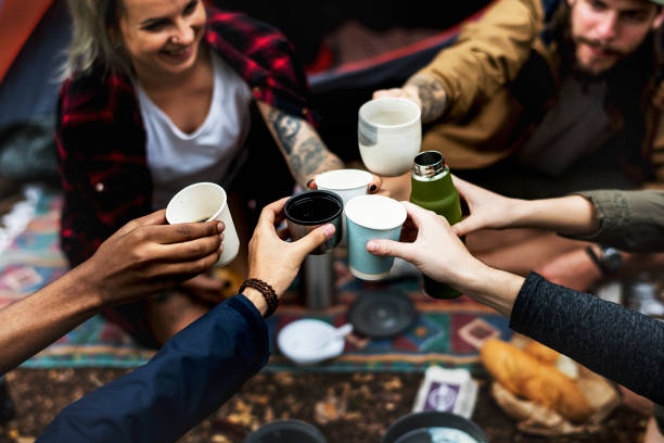 istock Friends camping in the forest together 964761682