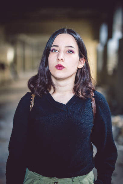 istock Brunette girl in a dark sweater 964762624