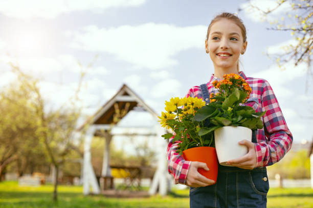 istock Positive nice girl standing in the garden 964765302