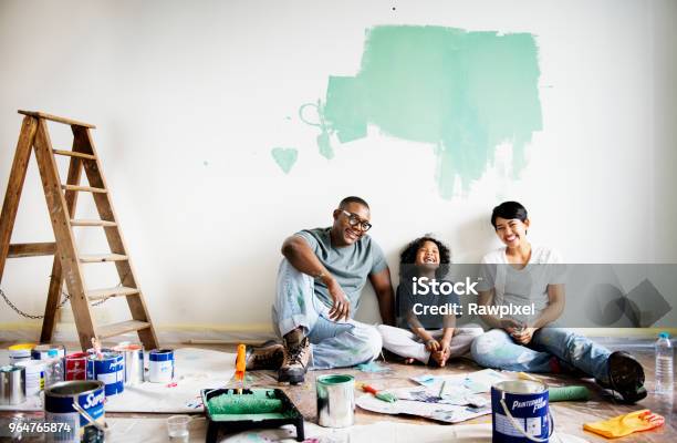 Black Family Painting House Wall Stock Photo - Download Image Now - Family, Renovation, Painting - Activity