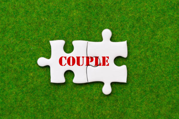 istock two connected jigsaw puzzle pieces with couple woring 964767966