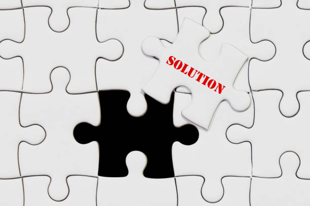 istock piece of jigsaw puzzle with solution wording for business concept 964771772