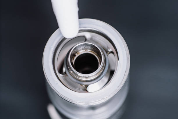 istock fueling a vape smoking an electronic cigarette, ru Macro shot of 964774530