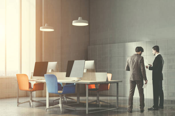 istock Corner of orange and blue chairs office toned 964782312