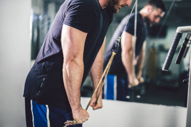 istock Young handsome man exercise in the gym. 964782508