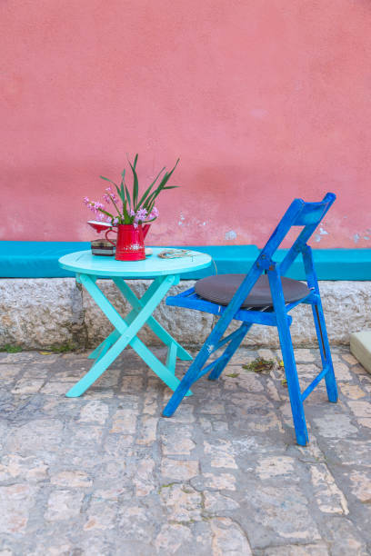 istock Still life with table and chair at the old color facade. 964789506