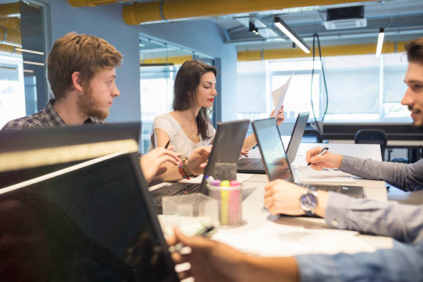 istock Young coworkers in modern office 964792744
