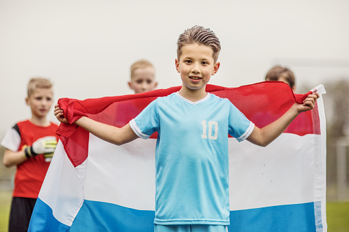 A dutch boys soccer team celebrating a victory