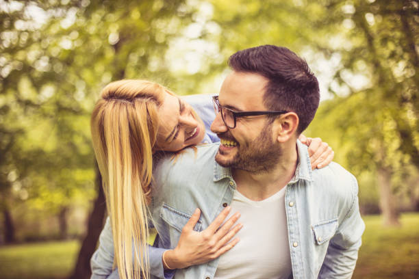 istock Playful couple at park. 964796770