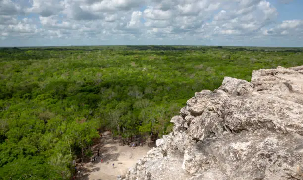 Photo of Cobà Nohoch mul Mayan pyramid with crowd of tourists