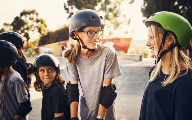 For the love of skating Shot of a group of young girls skateboarding together at a skatepark skating photos stock pictures, royalty-free photos & images
