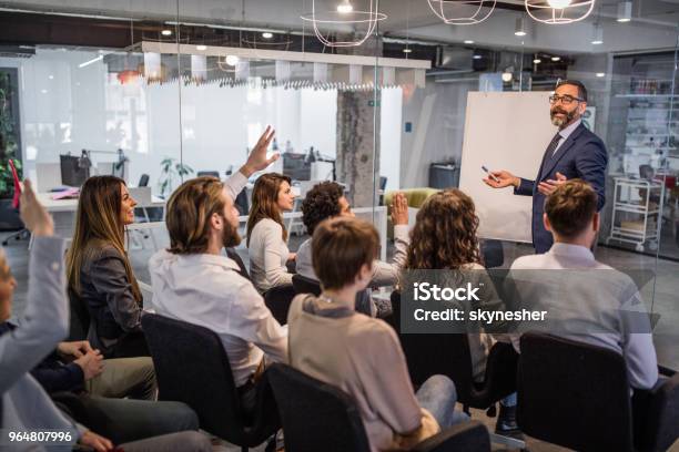 Happy Ceo Giving His Team A Business Presentation In A Board Room Stock Photo - Download Image Now