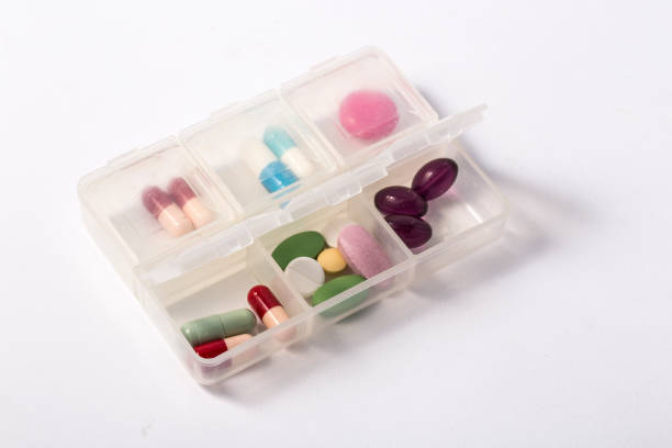 istock Daily drug dose / pills organized in a pill case 964808294