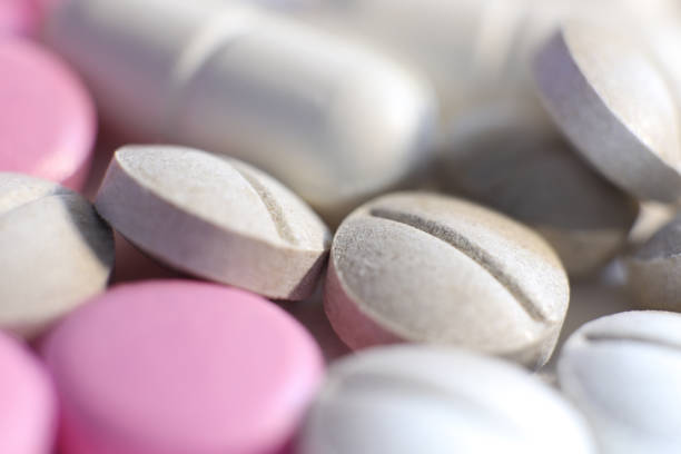 istock Different Scattered Medicine Tablets. Pharmacy Pills Background. Macro Closeup. 964808300