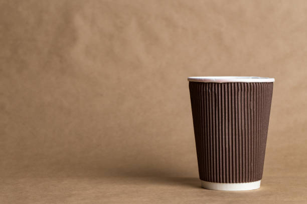istock coffeeto  go in a disposable cup on a craft background 964809710
