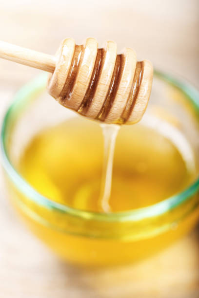 istock floral honey in a glass plate on the table. 964811822