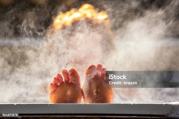 Woman Holds Her Feet Up While In A Hot Tub Stock Photo - Download Image Now - Bathtub, Heat - Temperature, Steam
