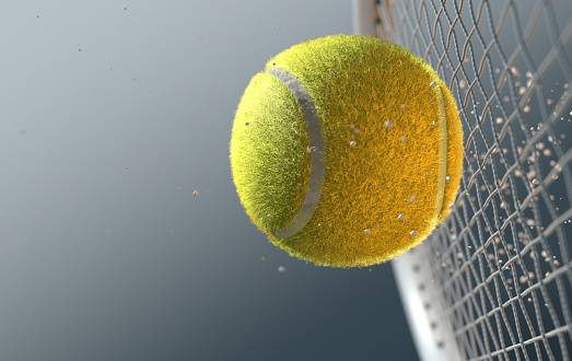 An extreme closeup slow motion action capture of a tennis ball striking a racquet with dirt particles emanating on a dark isolated background - 3D render\