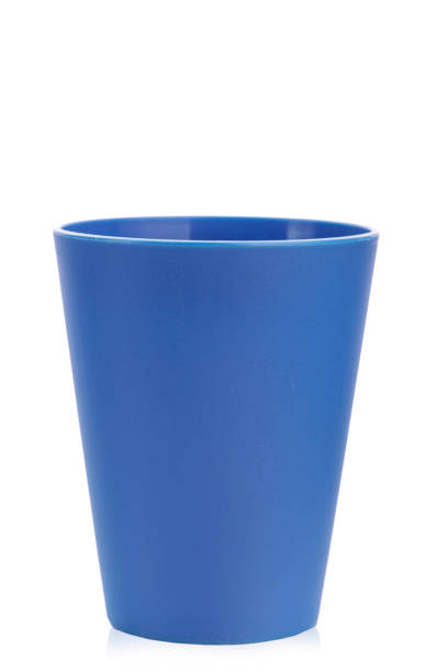 istock colored plastic glass for children's holiday on a white background isolated. 964820376