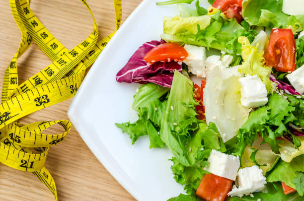 istock Dietary salad with tomatoes and feta cheese 964821938