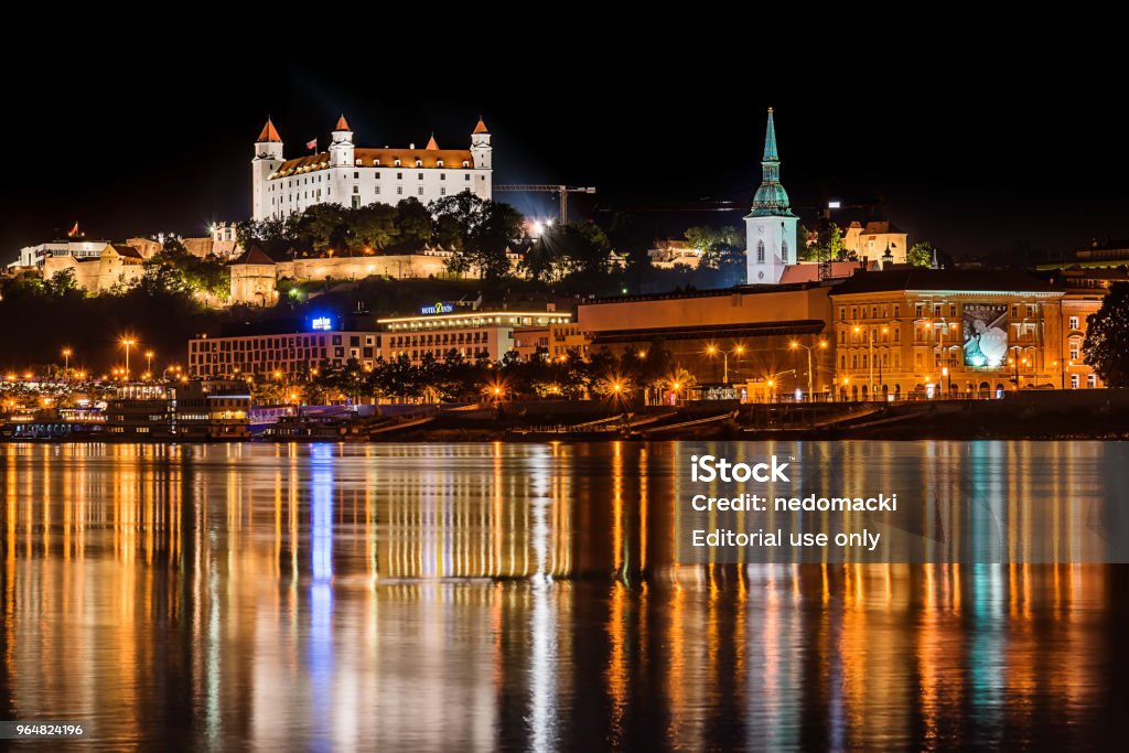 Bratislava at night Bratislava, Slovakia May 23, 2018: Bratislava at night, with the city lights reflected in the Danube river. On the top hill stands the Bratislava Castle built in the 9th century. Architecture Stock Photo
