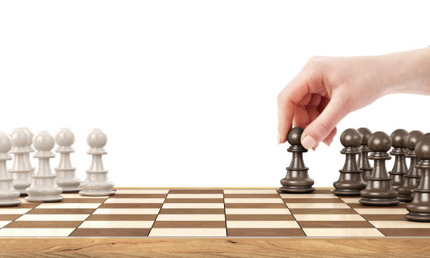 istock Female hand playing chess on a white background 964824358