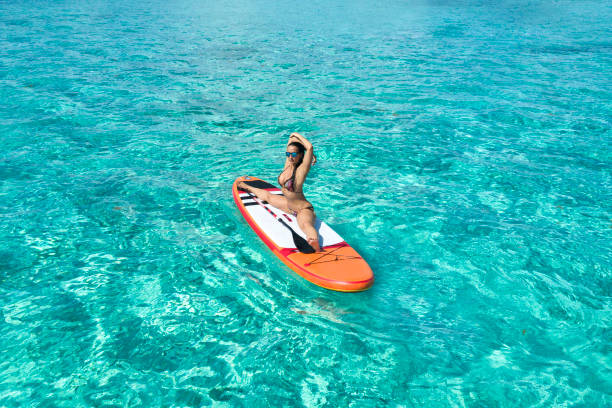 istock Woman on the paddleboard 964827584
