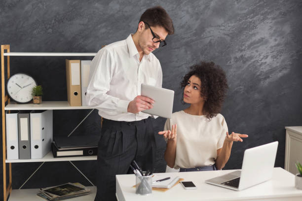 istock Couple of business partners work at modern office 964828444