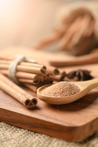 istock brown sugar on wood spoon and cinnamon sticks 964832496