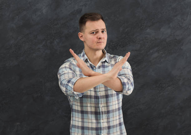 istock Man making stop sign with crossed hands 964835336