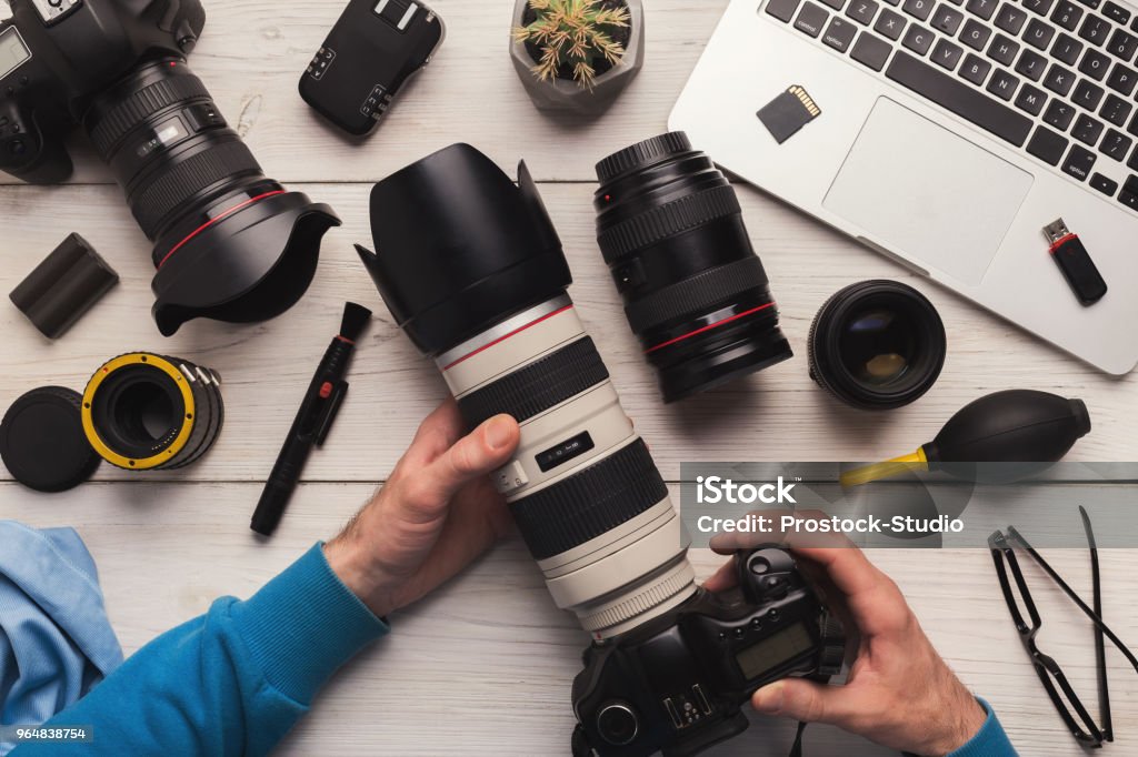 Maintenance of photo camera after cleaning Maintenance of photo camera after cleaning, top view. Professional photographing equipment care, technology concept Lens - Optical Instrument Stock Photo