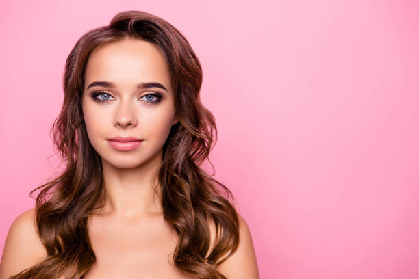 istock Portrait with copy space, empty place for advertisement, product of shine, charming, attractive, adorable, sexy girl with curly hair, looking at camera isolated on pink background 964843196