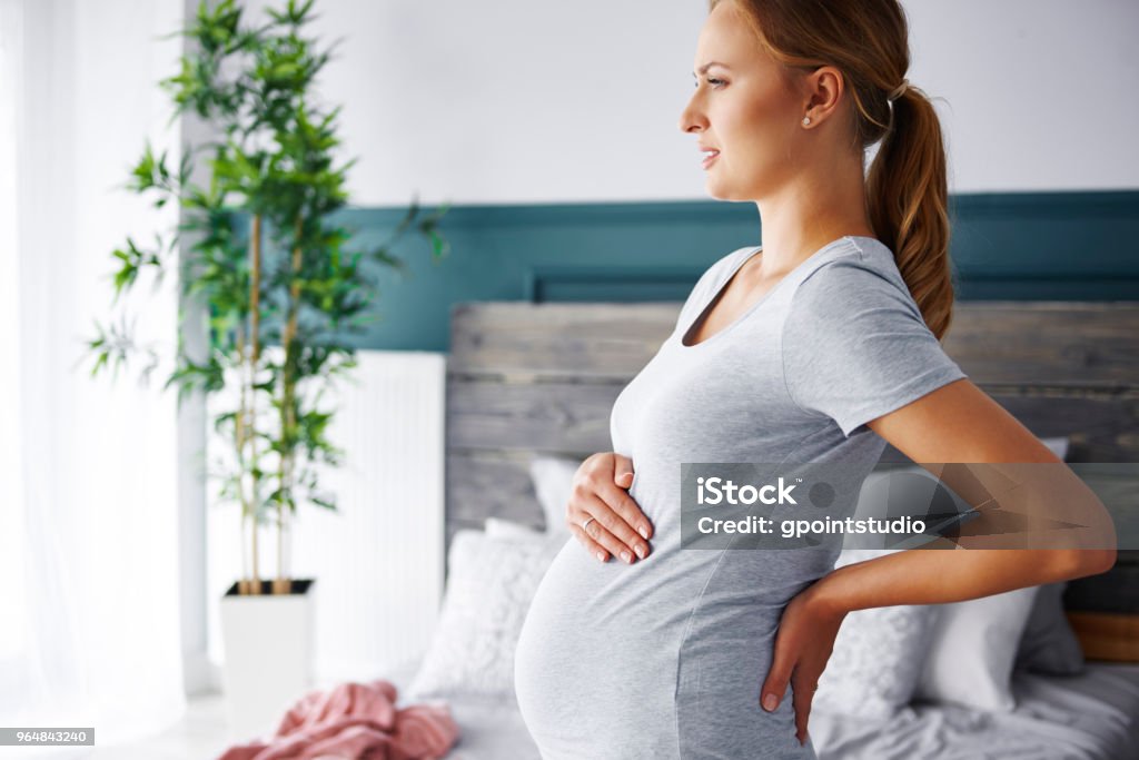 Young pregnant woman suffering from backache Pregnant Stock Photo