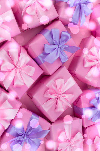 istock Decorative holiday gift boxes with pink color on pink background. 964845788