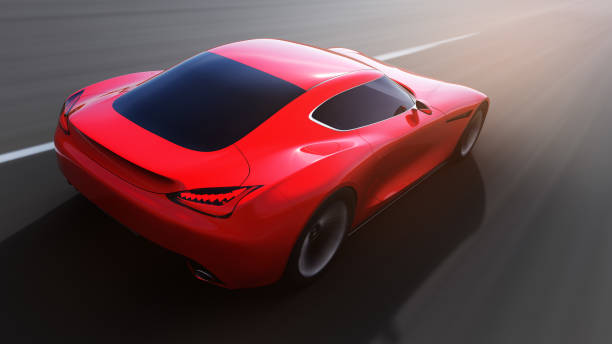 istock red car driving on a road 964848106