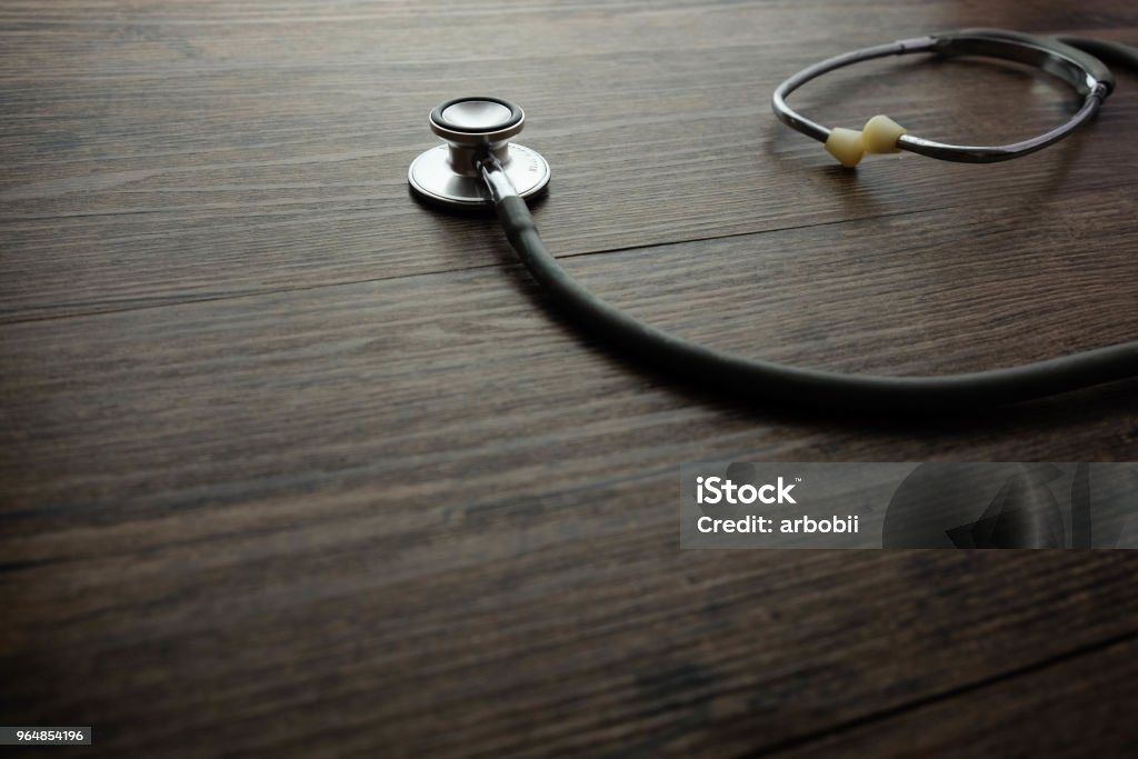 Stethoscope on wooden table background. medical health concept Border - Frame Stock Photo
