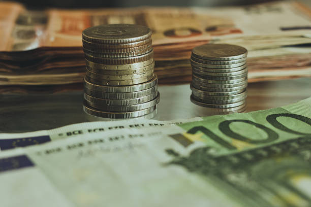 istock coins and paper money. 964854810