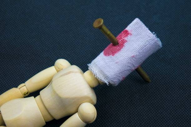 istock Wooden figure wounded 964866666