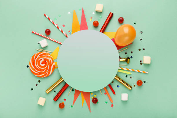Children birthday party background Children birthday party background, frame with sweets and lollipops on green surface, copy space, top view birthday cake photos stock pictures, royalty-free photos & images