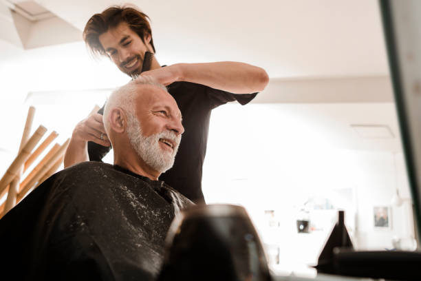 Senior man at hairdresser senior man visiting barber shop men hair cut stock pictures, royalty-free photos & images