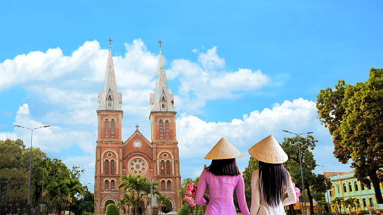 Beautiful women with Notre dame cathedral, Ho chi minh city Vietnam