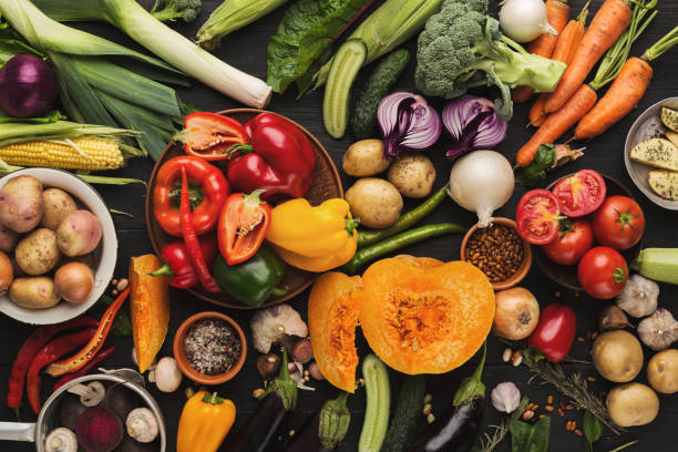 istock Heap of fresh vegetables on wooden background with copy space 964886904