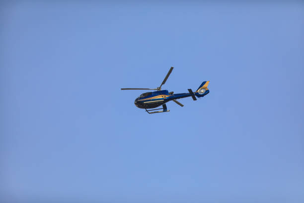 istock helicopter high in the sky 964888380