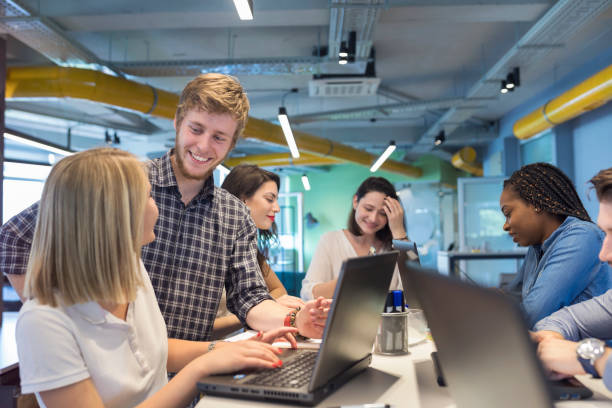 istock Young coworkers in modern office 964894400