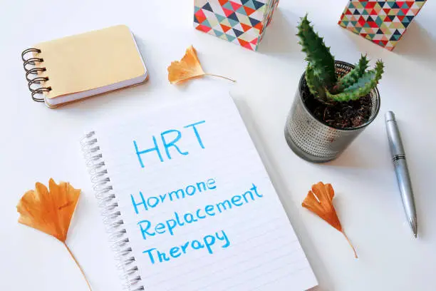 Photo of HRT Hormone Replacement Therapy written in notebook