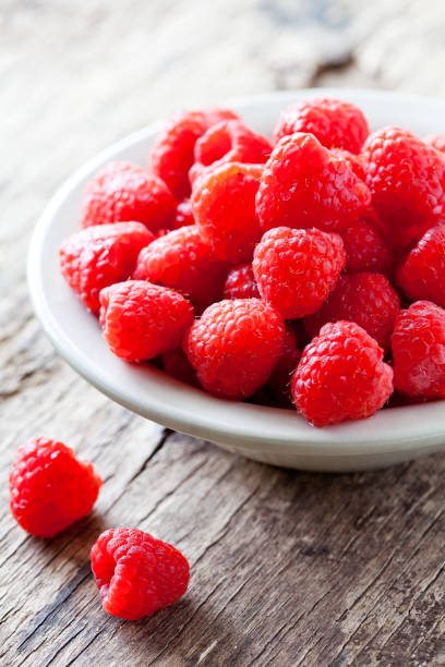 istock Bowl Of Organic Raspberries 964896246