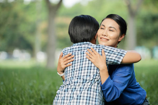istock Loving Mother Embracing Little Son 964898570