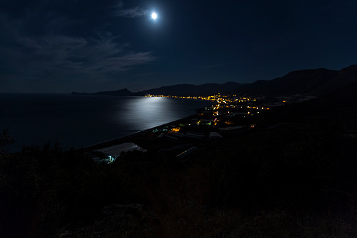 Gazipasa town of Antalya city night and full moon view. Gazipasa is a town and district of Antalya Province on the Mediterranean coast of southern Turkey, 180 km east of the city of Antalya.